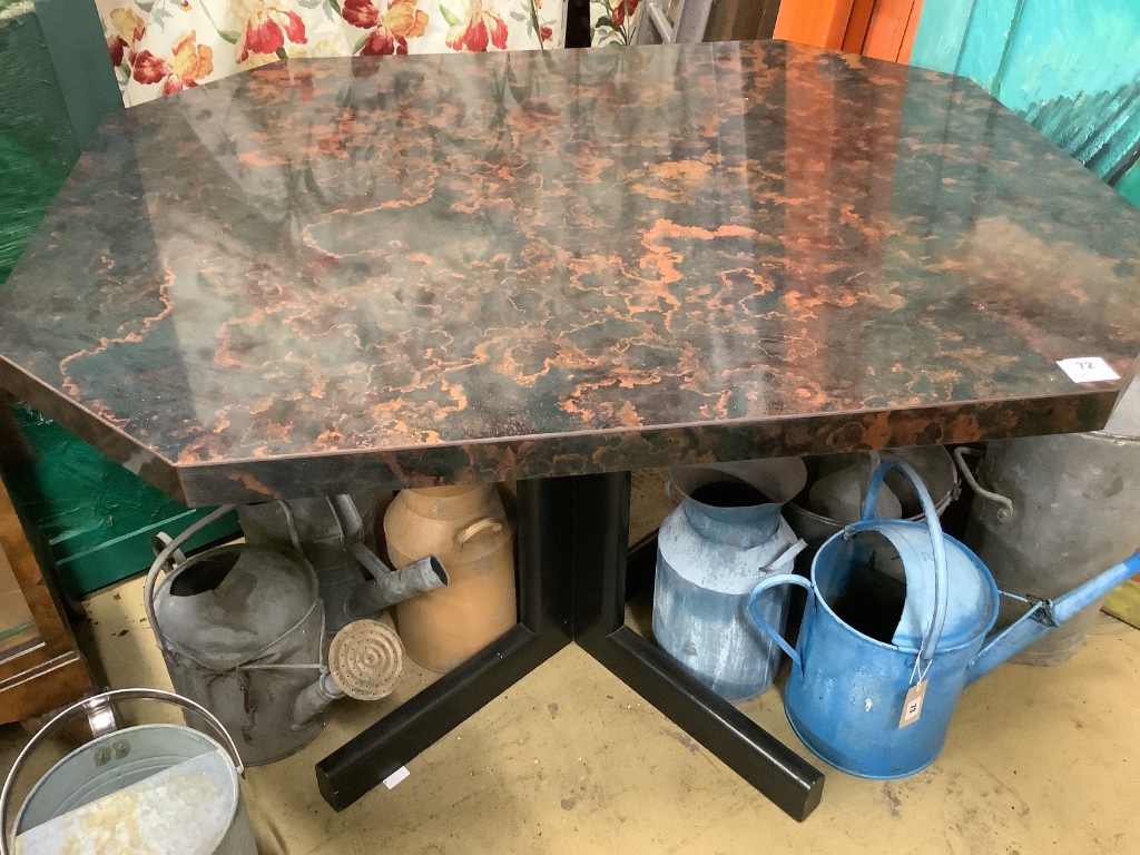 An octagonal bakelite faux marble centre table, width 116cm depth 100cm height 72cm